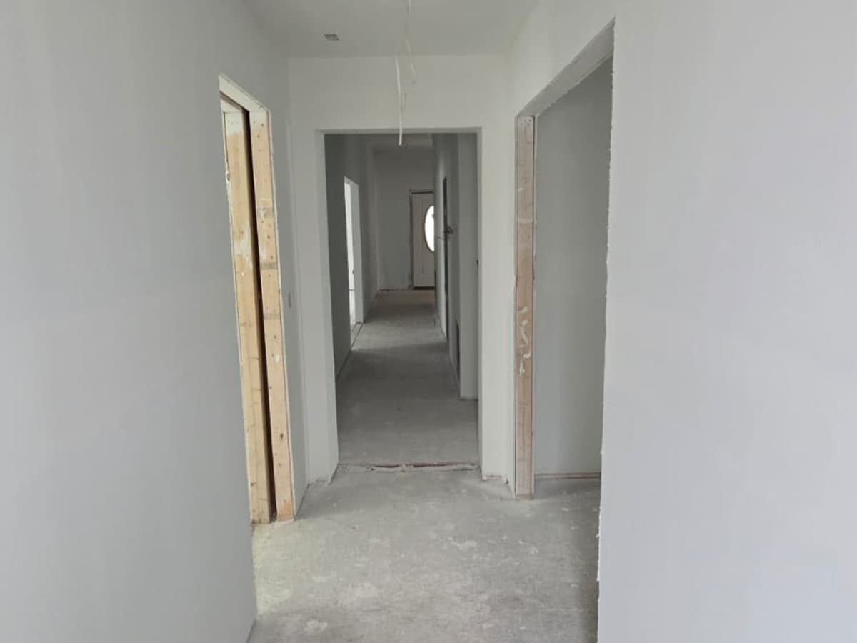Hewitt project, finished drywall hallway